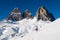 Dolomites covered by snow and sporty people with s