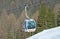 Dolomites , Italy - December 23, 2015: Nebelhorn cable car moving up Mountain in winter time. The offers close views of