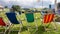 Dolomites, Italy. Group of colored deckchairs outside the mountain lodge in summer time