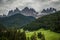 Dolomites, Italy - July, 2019: Famous best alpine place of the world, Santa Maddalena village with Dolomites mountains in