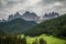 Dolomites, Italy - July, 2019: Famous best alpine place of the world, Santa Maddalena village with Dolomites mountains in