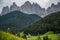 Dolomites, Italy - July, 2019: Famous best alpine place of the world, Santa Maddalena village with Dolomites mountains in