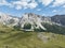 Dolomites Italy mountain range holiday alps landscape clouds aerial cinematic. Mountain aerial drone view. Panorama