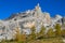 Dolomites rocky mountains and yellow trees in autumn