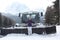 Dolomites skiing resort. Snowcat. Snow remover equipment.