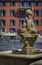 A dolphin fountain with old traditional houses in the background in Old Town Vielle Ville in Nice in the South of France