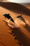 dolphins splashing across the sand dunes, ai generative