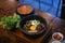 Dolsot bibimbap - Korean mixed rice, Include steamed rice, vegetables, pork and fried egg on top, served in a hot stone pot