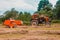 Dolyna, Ukraine July 11, 2020: Belarus tractor in the field, bale of hay, summer time, forage harvesting for cattle