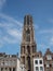 Dom cathedral tower Utrecht up in the air high with blue sky and clouds