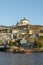 Dom Luis I Bridge over the river Duoro with rabelo boat in the city of Porto, Portugal