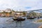 Dom Luis I bridge and traditional boats on Rio Douro river in Porto