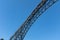 Dom Luis iron bridge structure detail seen from the bottom on a blue sunny sky background