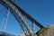 Dom Luis iron bridge structure detail seen from the bottom on a blue sunny sky background