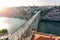 dom luiz brige in Porto on the riverside of Duero river cityscape at sunset from above view from Mosteiro da Serra do