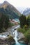 Dombay ski resort in autumn season, view on Amanaus river from the bridge in village, Caucasus, Russia