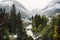 Dombay ski resort in autumn season, view on Amanaus river and snowy mountains from the bridge in village, Caucasus, Russia