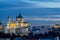 The dome of the Almuneda cathedral and the royal palace in Madrid seen from campo del Moro