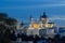 The dome of the Almuneda cathedral and the royal palace in Madrid seen from campo del Moro