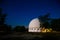 The dome of the astronomical telescope at night the stars Shine