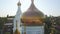 The dome of the Church and the cross top view over