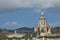 The dome of Church of King Cristo Re overlooking the city of Messina in Italy during summer. Beautiful photo of the landmark in