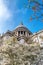 The dome of the famous St Pauls Cathedral, London. Springtime with pink and white cherry blossoms