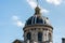 Dome of The Institut de France at the bank of Seine River, Paris. A French learned society, grouping five academies