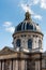 Dome of The Institut de France at the bank of Seine River, Paris. A French learned society, grouping five academies, the most famo