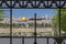 The Dome of the Rock on the Temple Mount, viewed through an ornate window with a cross in the Sanctuary of Dominus Flevit Roman