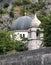 The dome of Saint Nicholas church rises above the wall of the medieval fortress in the Old Town of Kotor, Montenegro