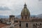 Dome of San Giuseppe dei Teatini church. Palermo skyline over roofs of historic buildings with the mountains in the background. I