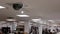 Dome security camera on top of ceiling inside Sears store