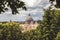 Dome of St. Peter in the Vatican city in Rome in Italy in the middle of the trees.