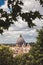 Dome of St. Peter in the Vatican city in Rome in Italy in the middle of the trees.