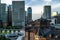 Dome of the Tokyo Station surrounded by skyscrapers under the sunlight at daytime in Japan