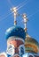 Domes of Russian orthodox church with cross against sky