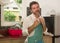 Domestic chores lifestyle portrait of 30s to 40s happy and attractive man wearing kitchen apron posing cool enjoying cooking ,