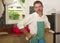 Domestic chores lifestyle portrait of 30s to 40s happy and attractive man wearing kitchen apron posing cool enjoying cooking ,