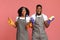 Domestic Cleaning Team. Portrait Of Professional Cleaners Couple Posing With Household Supplies