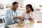 Domestic Leisure. Millennial Black Couple Sitting At Table, Having Breakfast In Kitchen