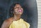 Domestic lifestyle mirror reflection portrait of young beautiful black afro American woman wet after having a shower drying hair