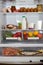 Domestic refrigerator full of a variety of foods