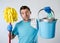 Domestic service man or stressed husband housework washing holding mop and bucket