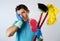 Domestic service man or stressed husband housework washing with sponge mop and broom