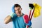 Domestic service man or stressed husband housework washing with sponge mop and broom