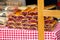 Domestic strudels with flavor of cherry for sale at Christmas market place outdoors. Fresh homemade cakes with cherry filling.