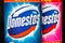 Domestos bleach bottles one in front of the other.