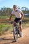 Dominating the trails. A young man riding his mountain bike on a forest trail.