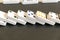 Domino effect shot. Look down for domino game on black background. Dominoes falling in a row in front. Dominoes Game Pieces